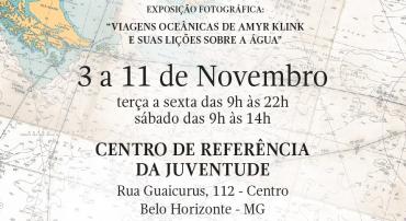 Sob o fundo de um mapa, lê-se: Exposição fotográfica: "Viagens oceânicas de Amyr Klink e suas lições sobre a água"; 3 a 11 de novembro, terça a sexta das 9h às 22h, sábado das 9h às 14h. Centro de Referência da Juventude: Rua Guaicurus, 112, Centro. Belo Horizonte - MG.